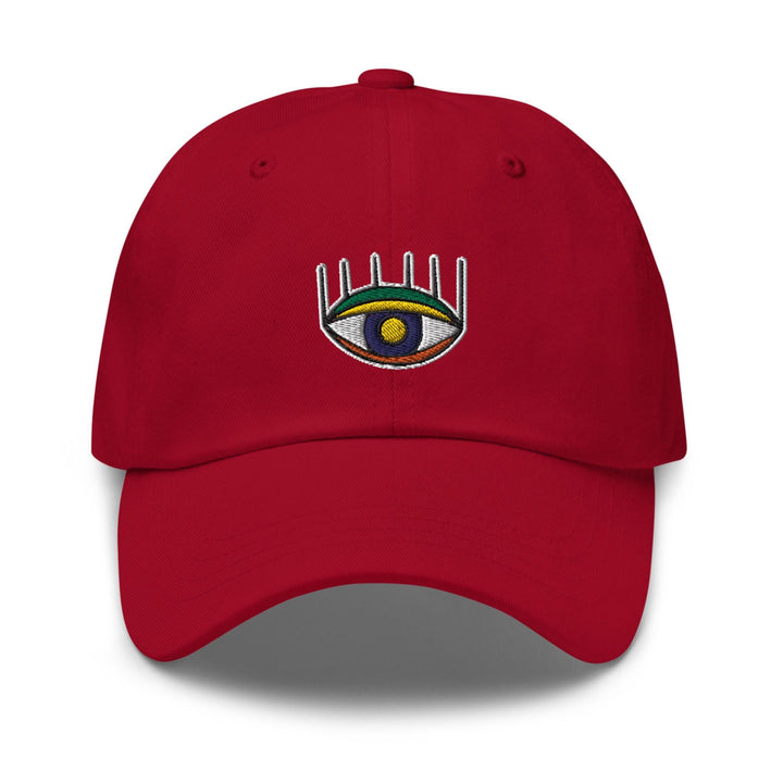 a red hat with an eye on it