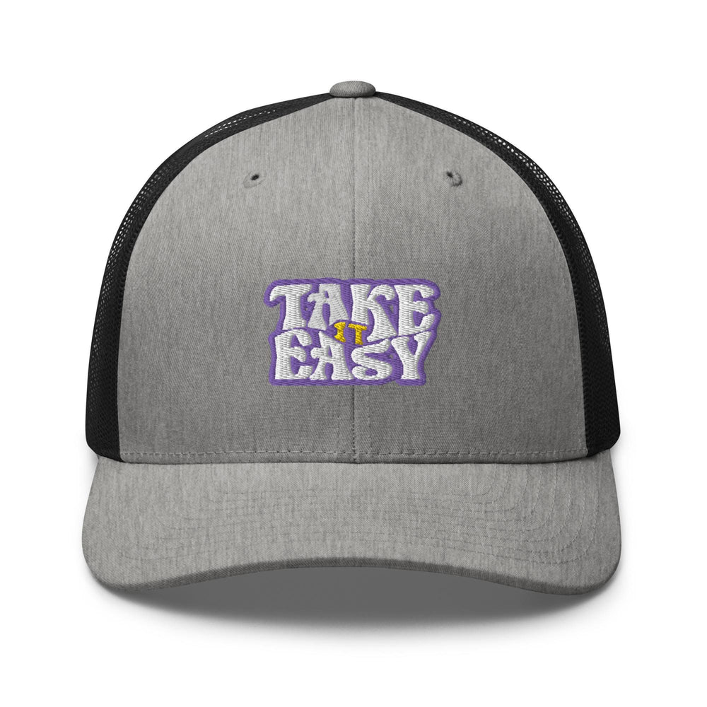a gray and black trucker hat with the words take easy on it