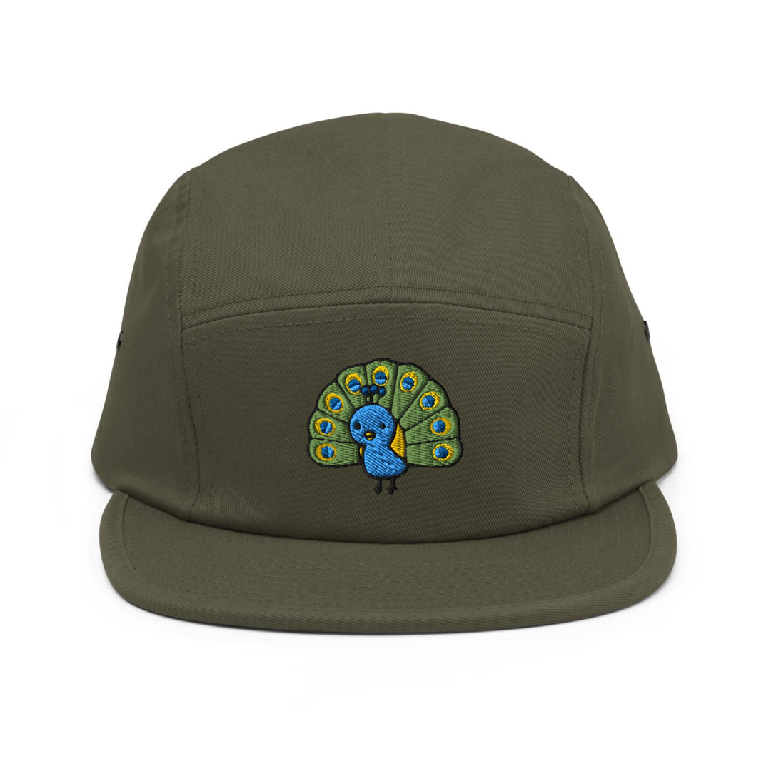 a green hat with a picture of a peacock on it