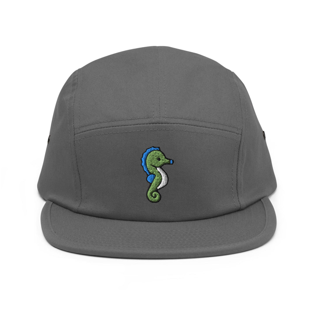 a gray hat with a green seahorse embroidered on it
