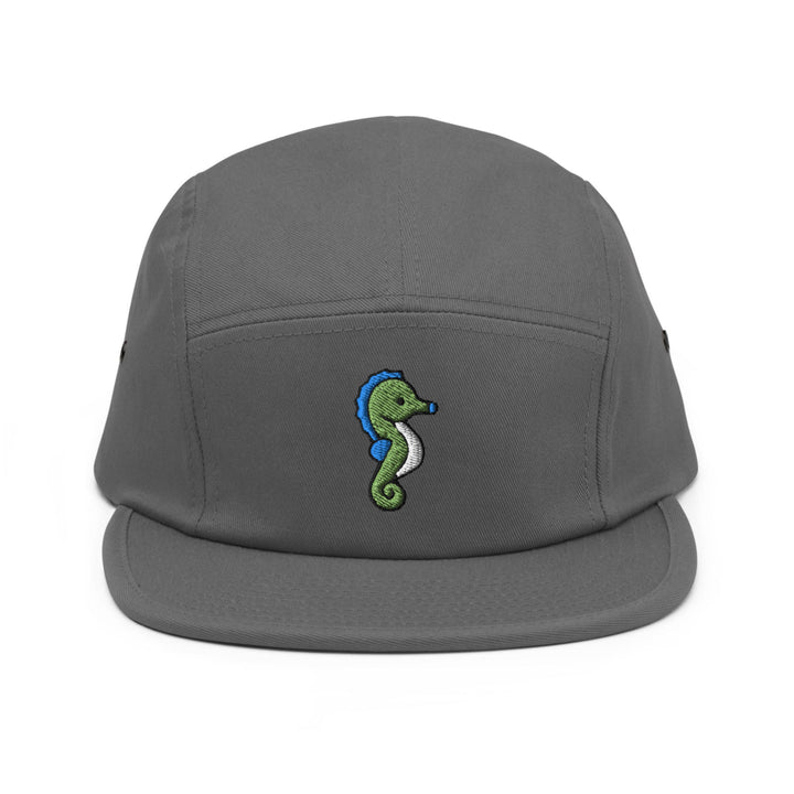 a gray hat with a green seahorse embroidered on it