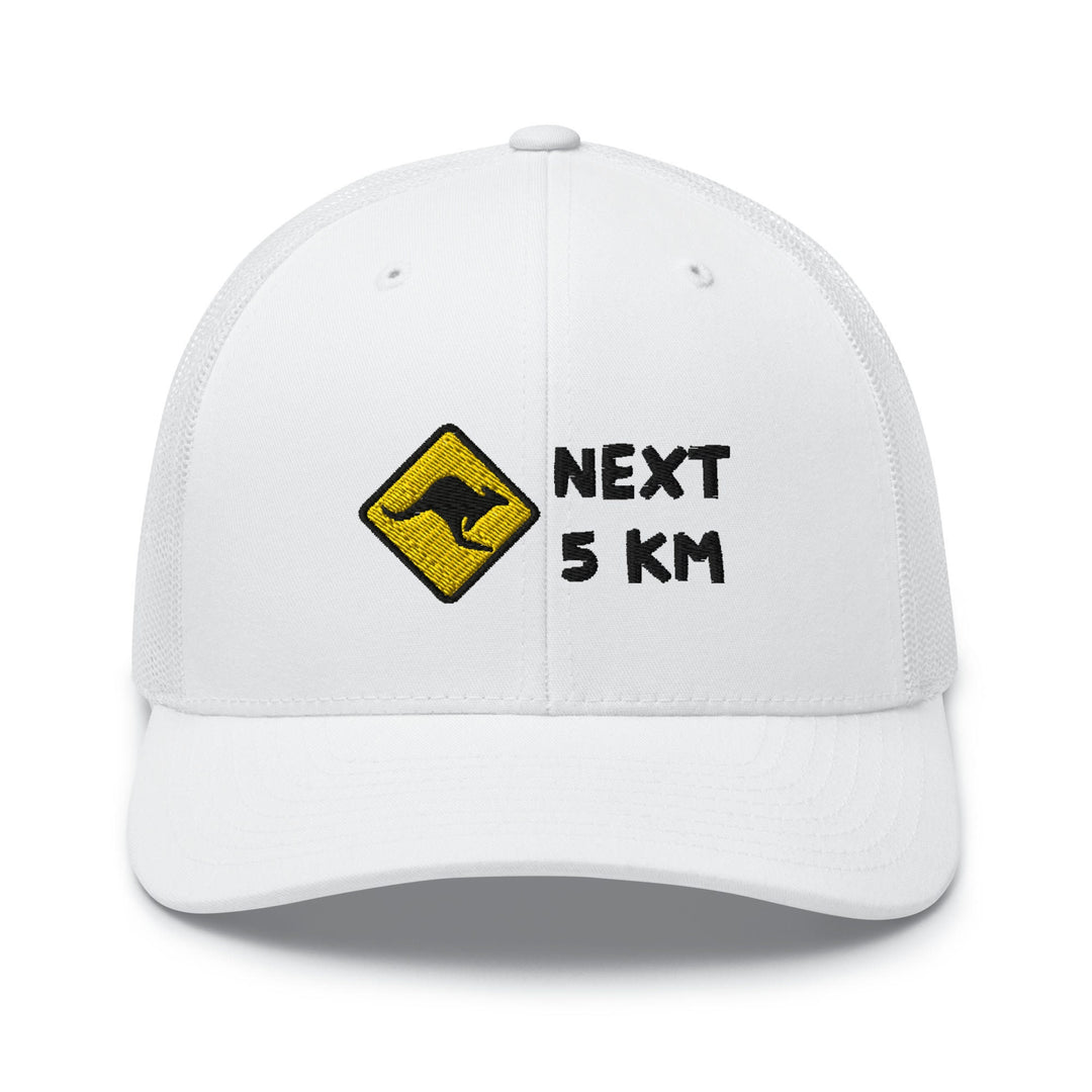 a white hat with the words next 5 km printed on it