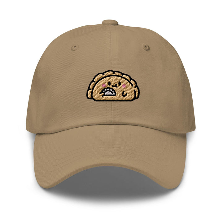 a tan hat with a cartoon turkey on it