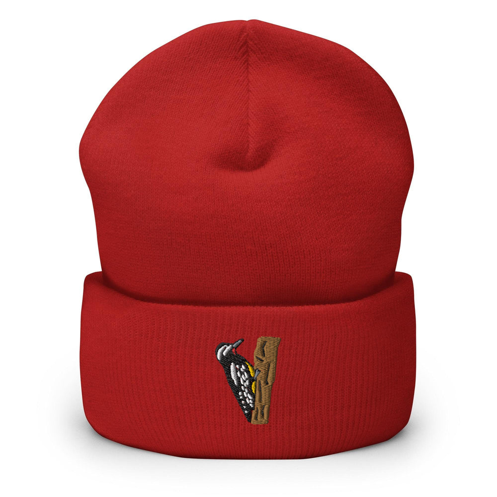 a red beanie with a picture of a bird on it