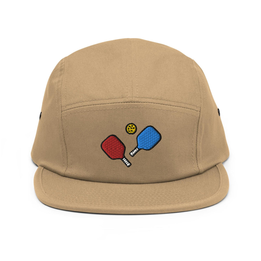 a tan hat with two ping pong paddles on it