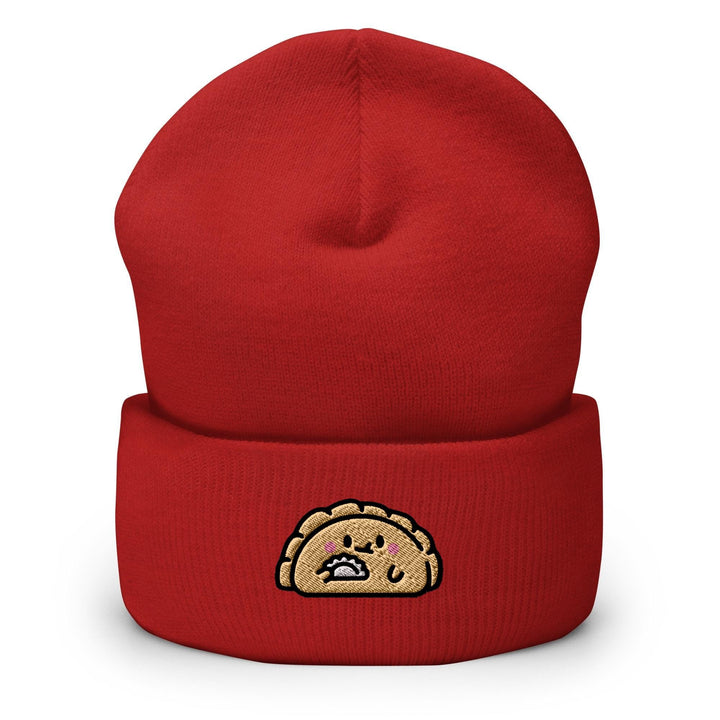 a red beanie with a cartoon turkey on it