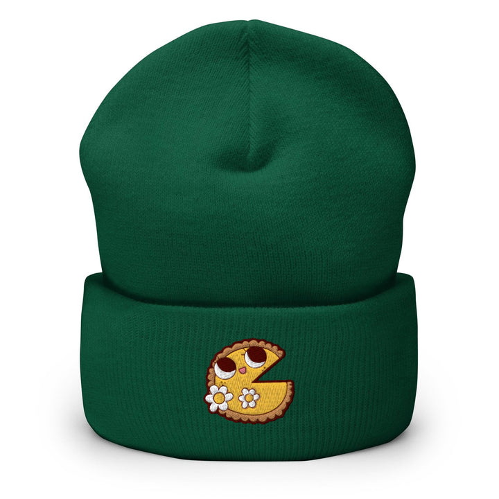 a green beanie with a piece of pie on it