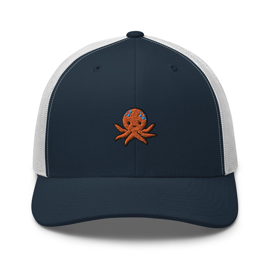 a blue and white trucker hat with an octopus embroidered on the front