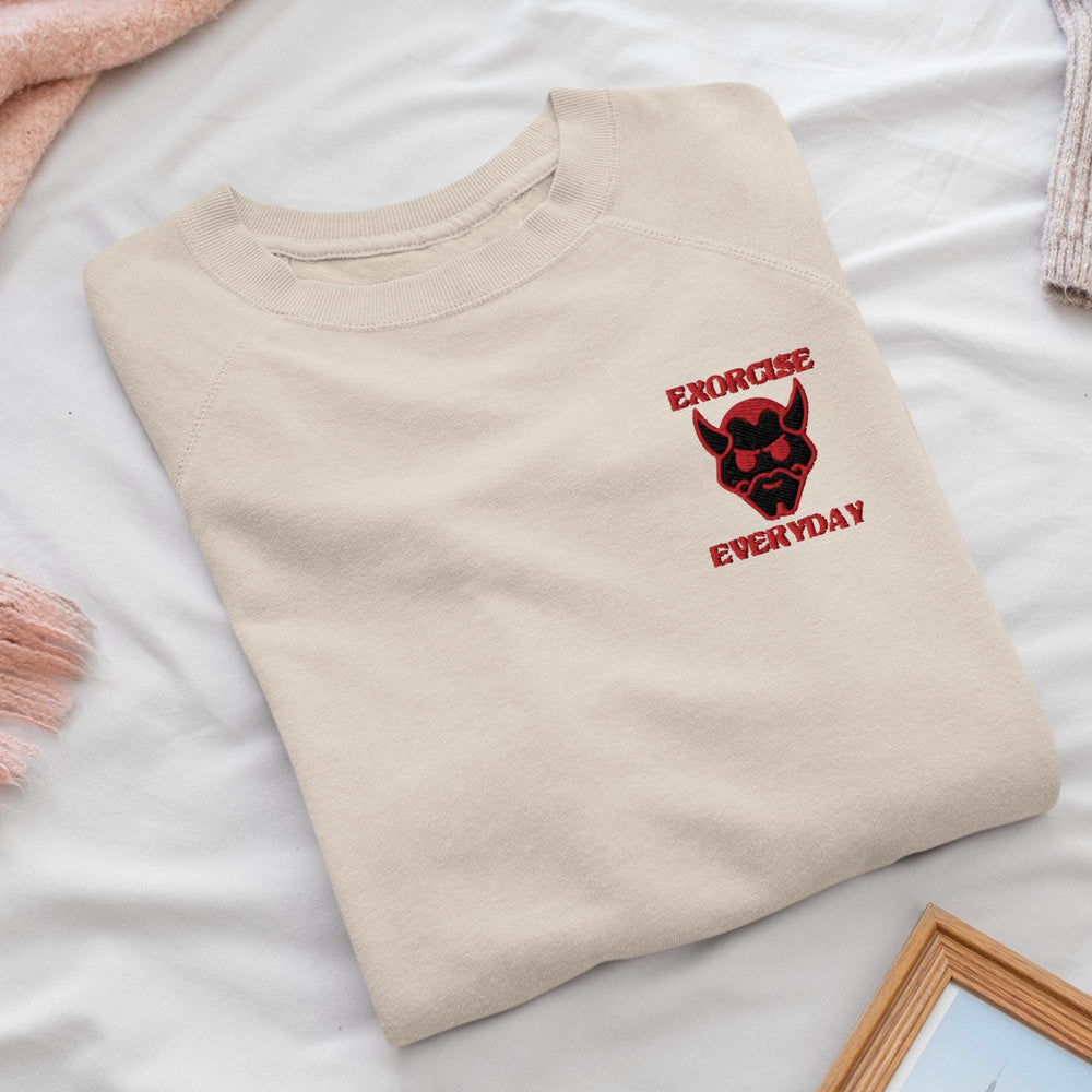 a t - shirt with a dog on it sitting on a bed