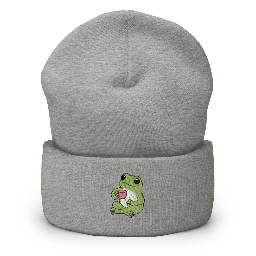a gray beanie with a green frog on it