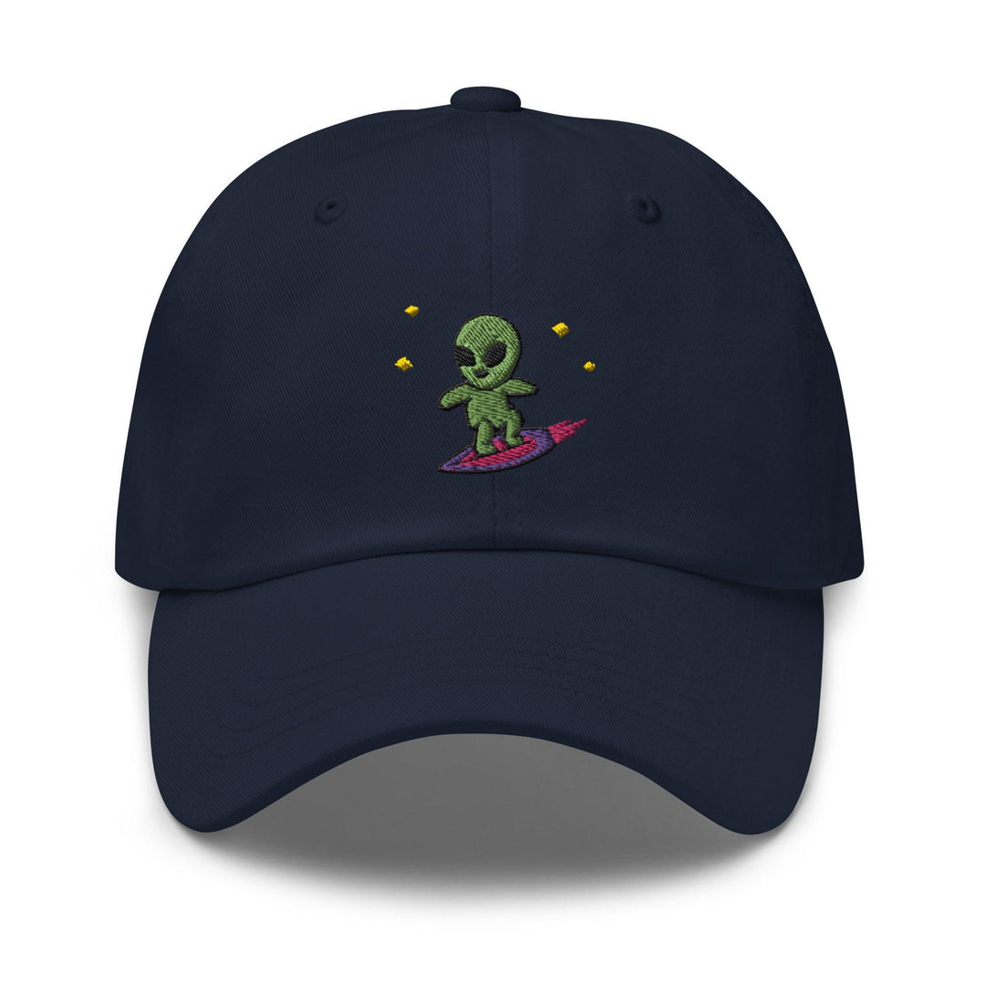 a blue hat with a green alien riding a surfboard
