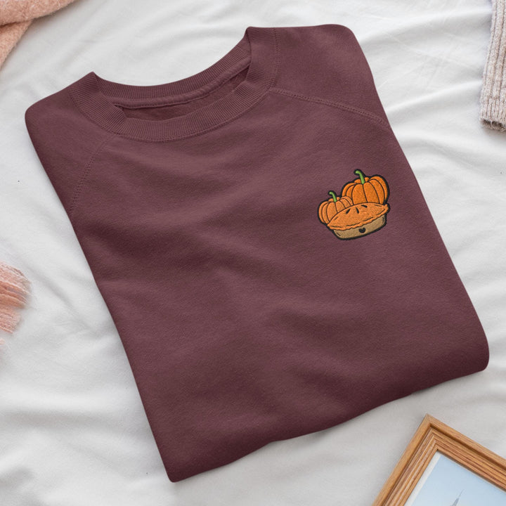 a t - shirt with a picture of a pumpkin on it