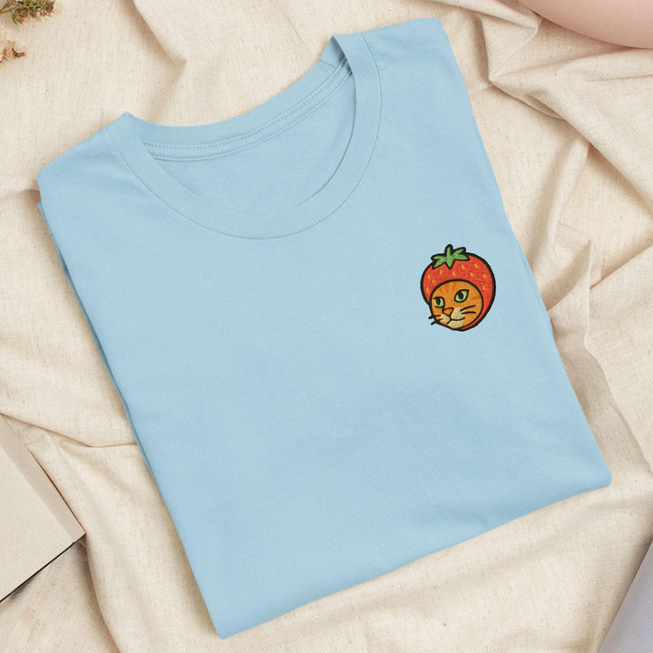 a blue shirt with a picture of a tomato on it