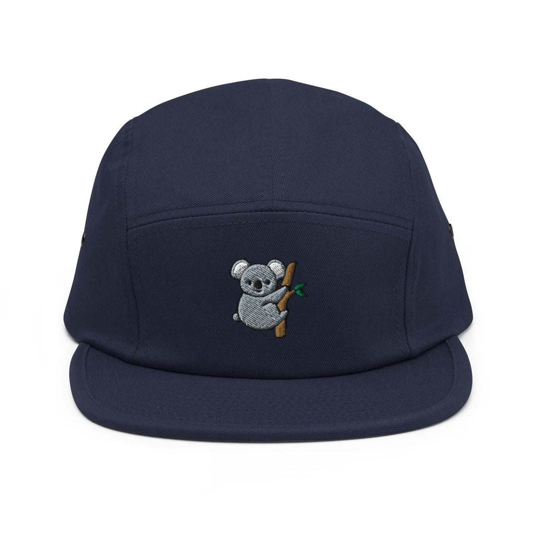 a blue hat with a koala bear on it