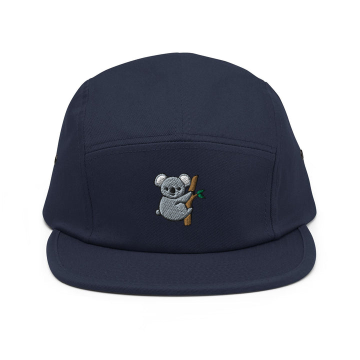 a blue hat with a koala bear on it
