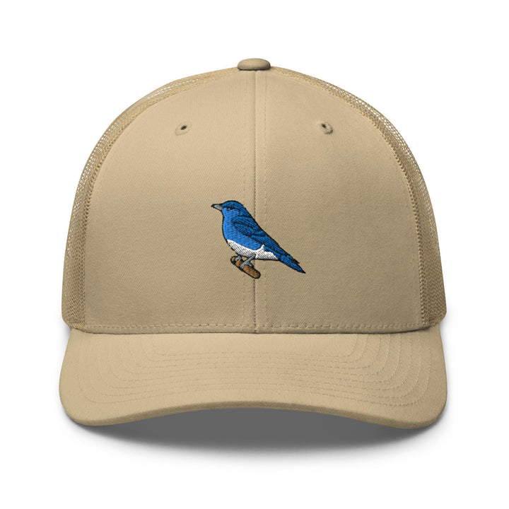 a tan hat with a blue bird on it