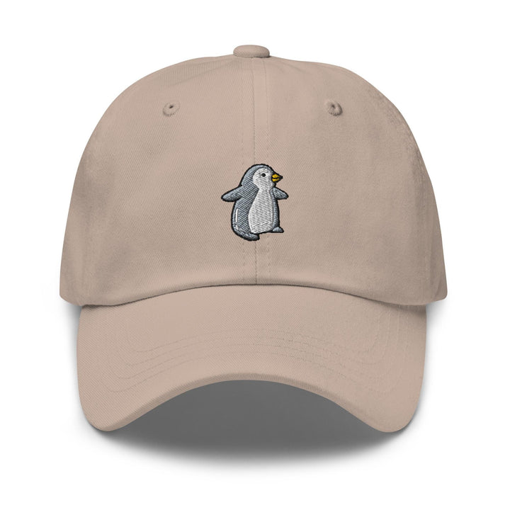 a tan hat with a penguin embroidered on it